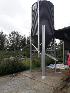 ANOTHER CUSTOMZED MEAL SILO FOR THIS FARMER WITH A SHOOT EXTENSION AND THE SILO ON HIGH LEGS FOR EASY ACESS TO FILL WITH A LOADER 